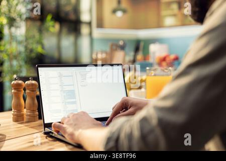 Adult programmer, developing web code, software systems on laptop, coding, debugging, data analysis, UX processes, and global network connectivity. Remote work in technology, high-tech. Stock Photo
