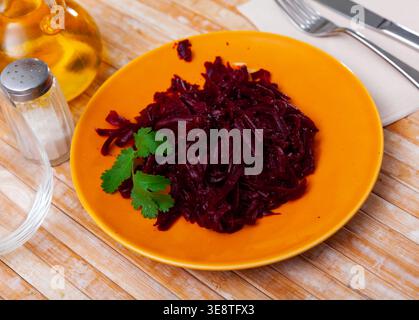 Salad of grated baked beetroot garnished with fresh parsley Stock Photo