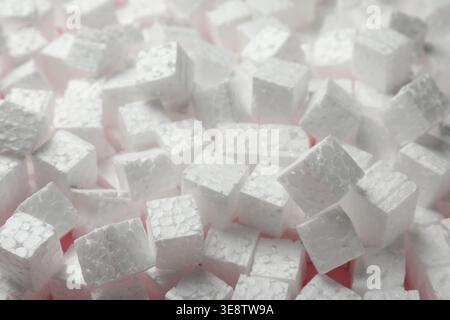 Pile of styrofoam cubes as background, closeup Stock Photo