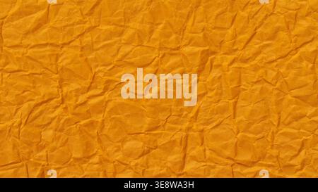 Crumpled orange paper texture background with rough wrinkled surface Stock Photo
