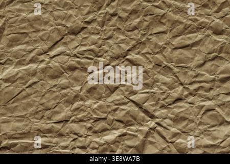 Brown crumpled kraft paper texture background with rough wrinkled surface Stock Photo
