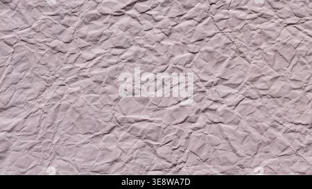 Light pink crumpled paper texture background with rough wrinkled surface Stock Photo