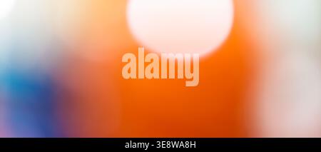 Abstract orange and blue gradient background with bright white bokeh circle and copy space Stock Photo
