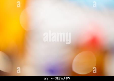 Colorful bokeh abstract background with yellow orange red and purple blurred light circles Stock Photo
