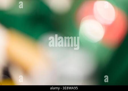 Dark green bokeh abstract background with red and white glowing light circles and golden accent Stock Photo