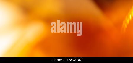 Warm golden orange abstract background with glowing light streak and dark red diagonal texture Stock Photo