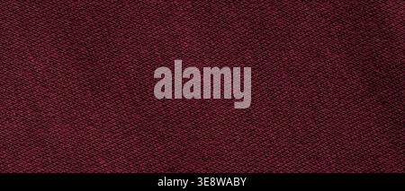 Dark burgundy woven fabric texture background with diagonal pattern close-up Stock Photo