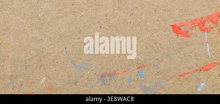 Grunge cardboard paper texture background with colorful paint splash and splatter marks Stock Photo