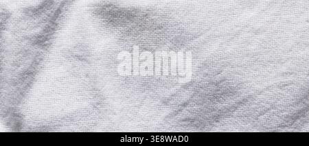 White knitted fabric background with gray tie-dye marbled pattern close-up Stock Photo