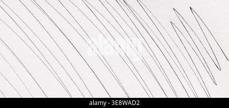 Abstract pencil line drawing on white paper with diagonal strokes and wavy marks close-up Stock Photo