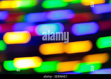 Defocused colorful LED neon light strips bokeh background for party and celebration concept Stock Photo