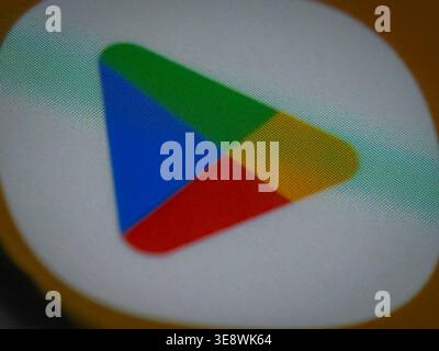 macro close up of google play store logo on a digital screen showing visible rgb pixels and subpixels with a soft bokeh blur Stock Photo