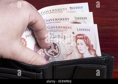 Currency of the Isle of Man - pounds in the black wallet Stock Photo