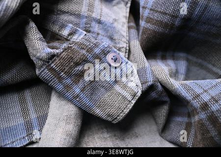 Grey and Off White Cotton Shirt Sleeves with Buttons — Grid Pattern Creased Fabric Macro Close-Up and Soft Defocused Backgrounds Stock Photo