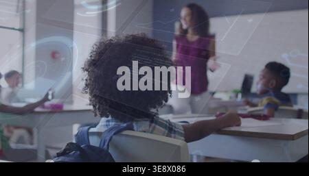 Sitting curly-haired student with backpack watching teacher wearing magenta top in classroom HUD Stock Photo