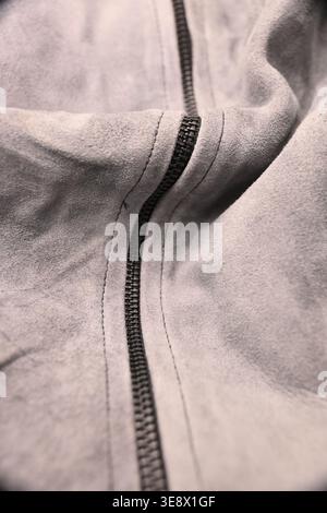 Grey Pure Leather Jacket with Black Zip — Creased Texture Macro Close-Up with Soft Defocused Backgrounds Stock Photo