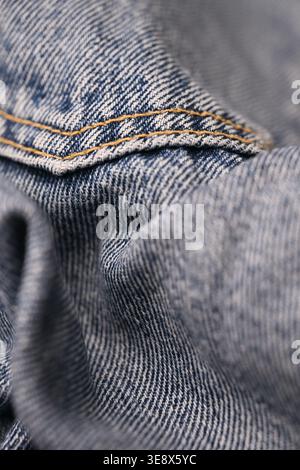 Blue Denim Jeans Fabric Texture — Creased Macro Close-Up with Soft Defocused Backgrounds Stock Photo