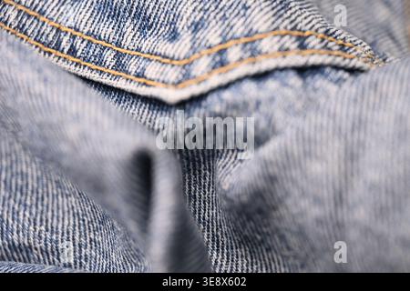 Blue Denim Jeans Fabric Texture — Creased Macro Close-Up with Soft Defocused Backgrounds Stock Photo
