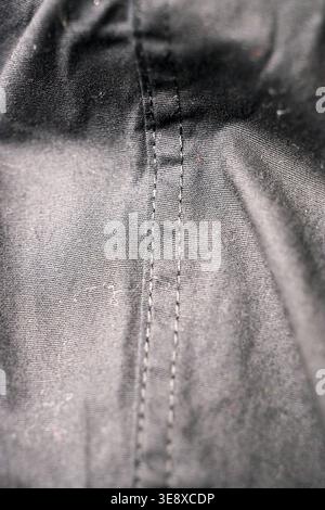 Dark Grey Shirt Fabric Close-Up — Creased Textile Texture with Soft Defocused Backgrounds Stock Photo