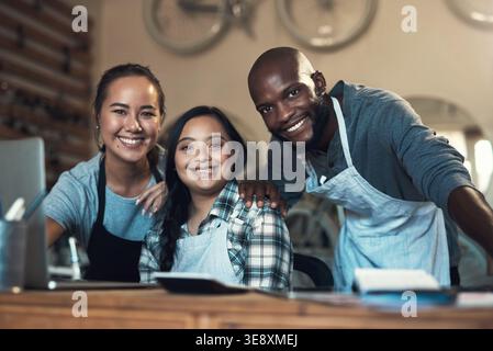 Smile, laptop and people in portrait for bike repair, small business and inclusion. Digital checklist, bicycle shop and woman with down syndrome for Stock Photo