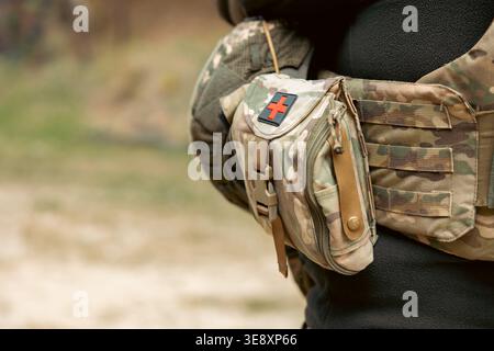 military first aid kit on a soldier's belt Stock Photo