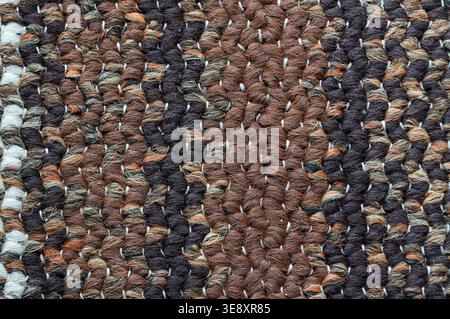 Knitted woolen texture. Knitted woolen background. Close-up. Stock Photo