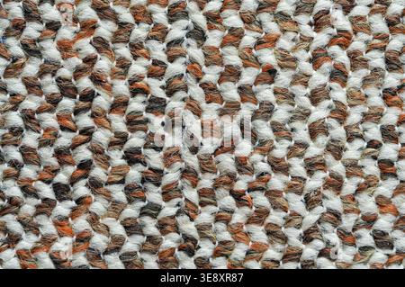 Knitted woolen texture. Knitted woolen background. Close-up. Stock Photo