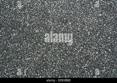 Photo for background. Asphalt texture. Playground covering close-up. Stock Photo