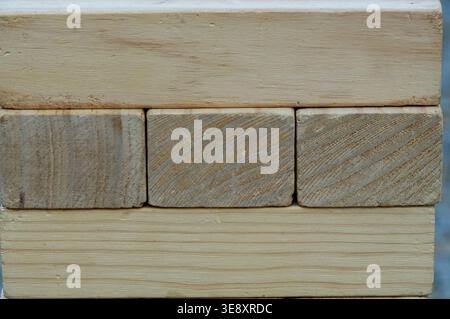 wooden blocks stacked in a row, close-up of photo Stock Photo
