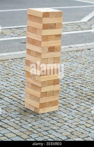 Wooden blocks stacked on top of each other on the street. Stock Photo