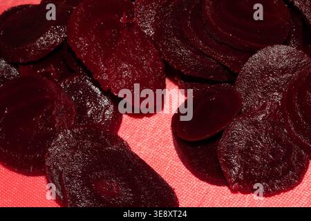 Close up of chopped red beetroot on a red background Stock Photo