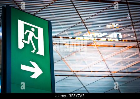 Sign of emergency exit in a Chinese airport, good for conceptual Stock Photo