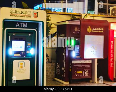 Cairo, Egypt, March 28 2026: several Automated Teller Machines (ATMs) operated by major banks in Egypt, like Banque Misr and NBE Al Ahly National Bank Stock Photo