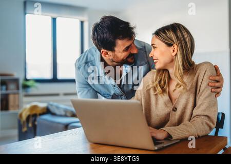 Online entertainment and social media. Diverse, multiethnic couple enjoying the digital world Stock Photo