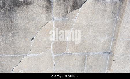 Gray stone wall with cracks, stone background Stock Photo