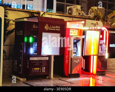 Cairo, Egypt, March 28 2026: several Automated Teller Machines (ATMs) operated by major banks in Egypt, like Banque Misr and NBE Al Ahly National Bank Stock Photo