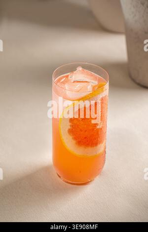 Grapefruit cocktail with citrus slices and ice Stock Photo