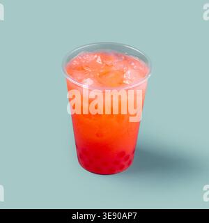 Fruit drink with ice in plastic cup Stock Photo