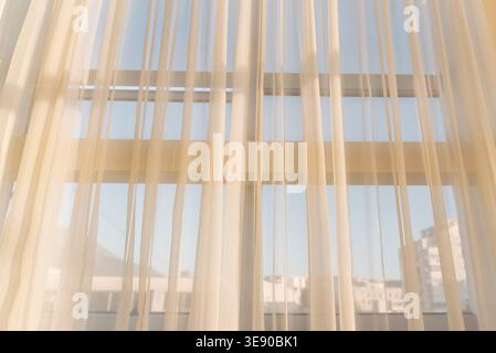 Transparent White Tulle Curtains Hanging On Window In Sunset Sunlight Abstract Background Stock Photo