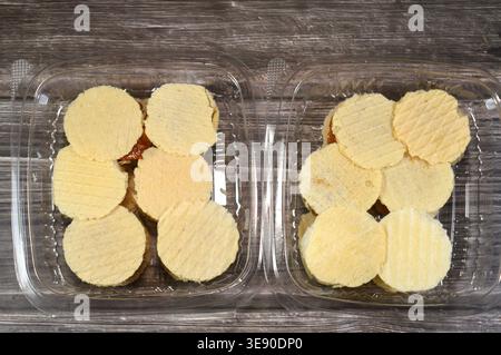 Assorted small, sweet treats, thin, crispy wafers sandwiching patties of sesame, peanuts or coconut, often held together by honey or sugar, popular on Stock Photo