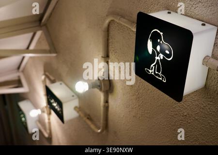 Snoopy Wall Lights With Retro Cartoon Silhouette Mounted On Textured Stucco Ceiling Stock Photo