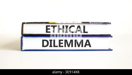 Ethical dilemma words symbol. Concept words Ethical dilemma on beautiful books. Beautiful white background. Business and Ethical dilemma words concept Stock Photo