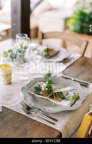 Elegant rustic table. Minimalist table setting featuring natural elements and vintage details Stock Photo