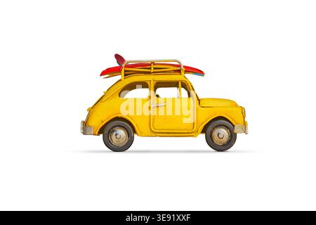 retro car with baggage, luggage and beach equipment on the roof, fully packed, ready for summer vacation Stock Photo