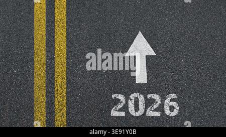 happy new year - 2026 and an arrow written on an asphalt road Stock Photo