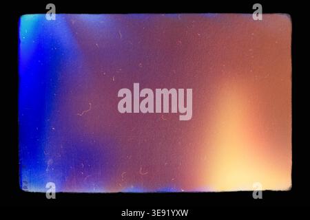 Abstract film texture background with grain, dust and light leak, framed, pattern with copy space. Stock Photo