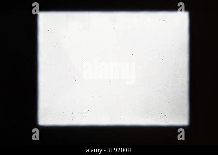 Abstract film texture background with grain, dust and light leak, framed, pattern with copy space. Stock Photo