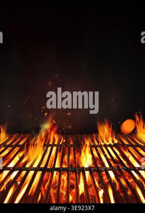 Fire embers particles over black background.  Grill Background - Empty Fired Barbecue On Black . Abstract dark glitter fire particles lights. Poster w Stock Photo