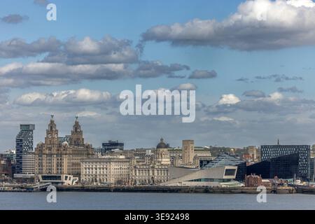 A wide panoramic view of the iconic Liverpool skyline and waterfront as seen from across the River Mersey Stock Photo