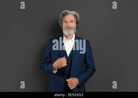 Anonymous man with pixelated face on grey background Stock Photo